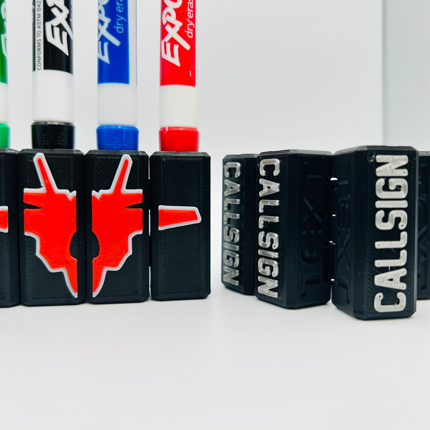 Custom Dry Erase Marker Holders that can have Callsigns, Jet silhouettes, and Side Text added to them. Jets include A-10, F-15, F-16, F-18, F-22, F-35, B-1, B-2, B-52, E-3, Mq-9, T-6, T-8, C-17, C-130, E-8, U-28. A perfect gift for military pilots. Available in Chisel Tip, Fine Tip and Visa-Vi.