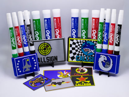 Assorted markers and display stands with various designs on a gray background