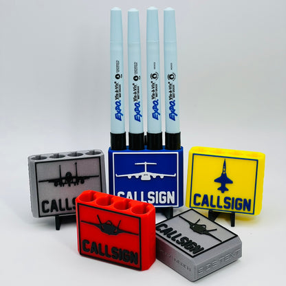 Custom Dry Erase Marker Holders that can have Callsigns, Jet silhouettes, and Side Text added to them. Jets include A-10, F-15, F-16, F-18, F-22, F-35, B-1, B-2, B-52, E-3, Mq-9, T-6, T-8, C-17, C-130, E-8, U-28.  A perfect gift for military pilots. Available in Chisel Tip, Fine Tip and Visa-Vi.