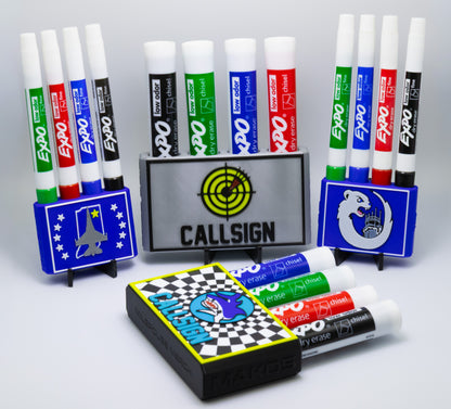 Collection of Expo dry erase markers with stands and a blackboard eraser on a gray background