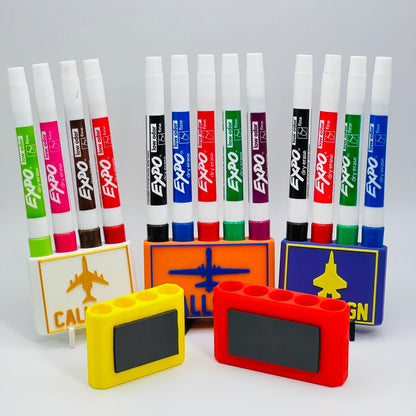 Custom Dry Erase Marker Holders that can have Callsigns, Jet silhouettes, and Side Text added to them. Jets include A-10, F-15, F-16, F-18, F-22, F-35, B-1, B-2, B-52, E-3, Mq-9, T-6, T-8, C-17, C-130, E-8, U-28.  A perfect gift for military pilots. Available in Chisel Tip, Fine Tip and Visa-Vi.