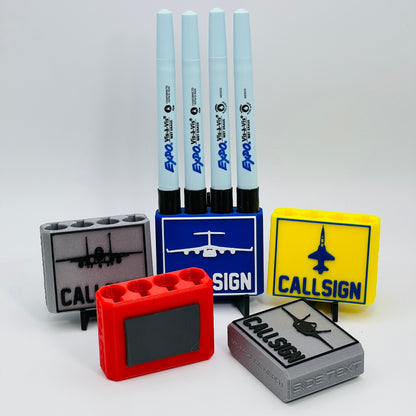 Custom Dry Erase Marker Holders that can have Callsigns, Jet silhouettes, and Side Text added to them. Jets include A-10, F-15, F-16, F-18, F-22, F-35, B-1, B-2, B-52, E-3, Mq-9, T-6, T-8, C-17, C-130, E-8, U-28.  A perfect gift for military pilots. Available in Chisel Tip, Fine Tip and Visa-Vi.